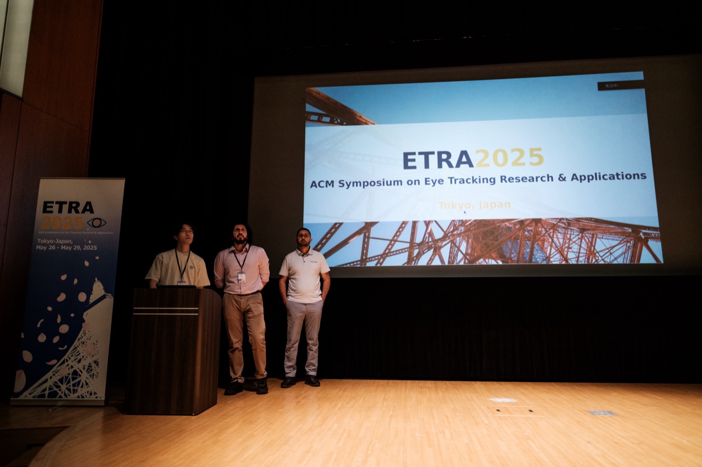The three General Chairs on stage at the opening of ETRA 2025 in Tokyo